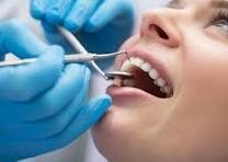 Dentist examining a patient's teeth